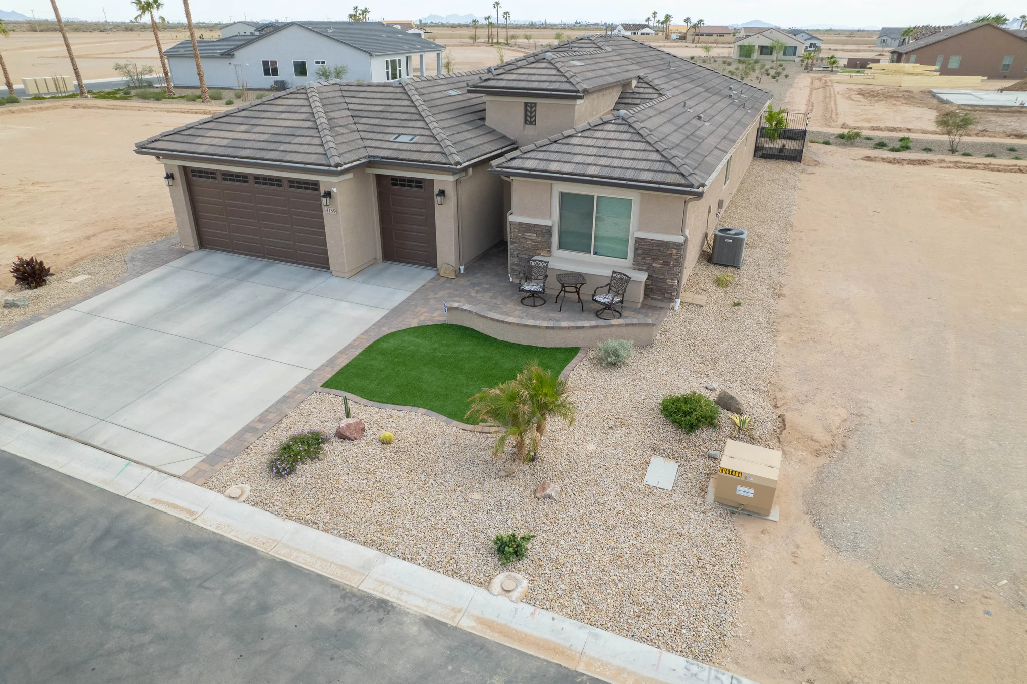 Aerial view of modern desert home with three-car garage