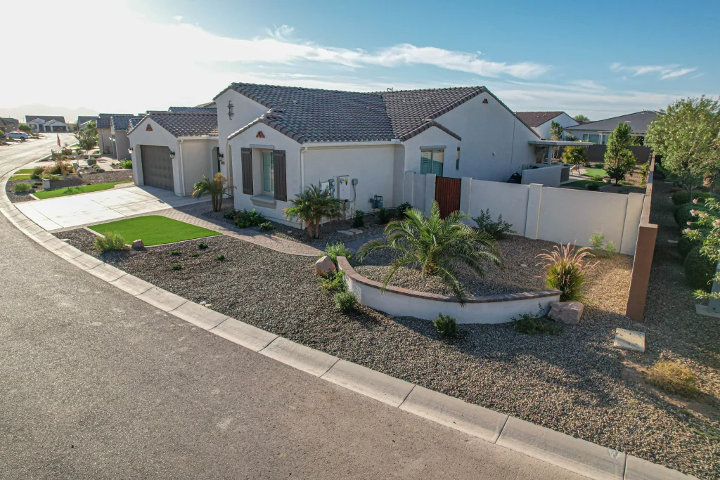 Single-story stucco home with landscaped desert front yard